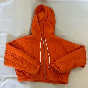 Urban Outfitters orange cropped zip up